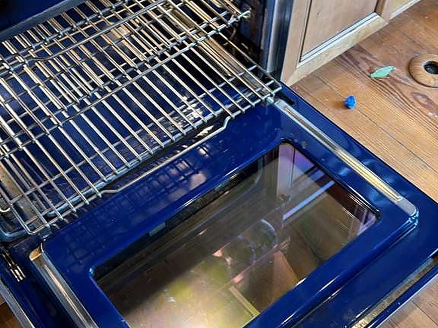 Oven interior with the racks and door glass cleaned