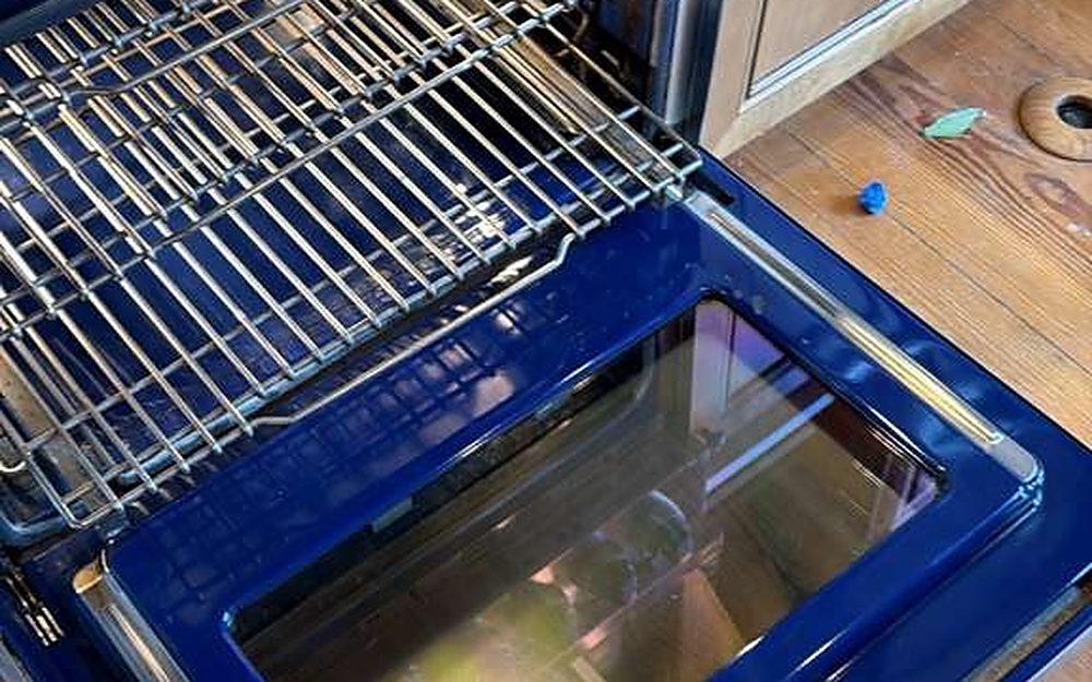 Oven interior with the racks and door glass cleaned